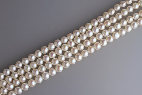 Two Hold Button Freshwater Pearl Strand 10-10.5mm